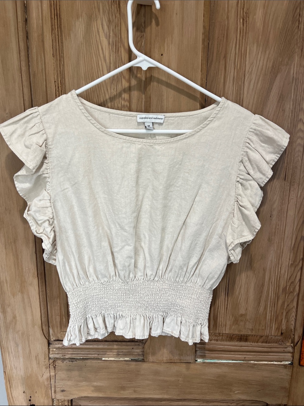 cupcakes & cashmere cream ruffle sleeve smocked-hem crop top